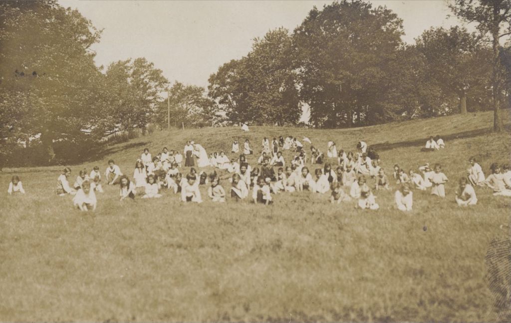 Miniature of Children crouched in a field