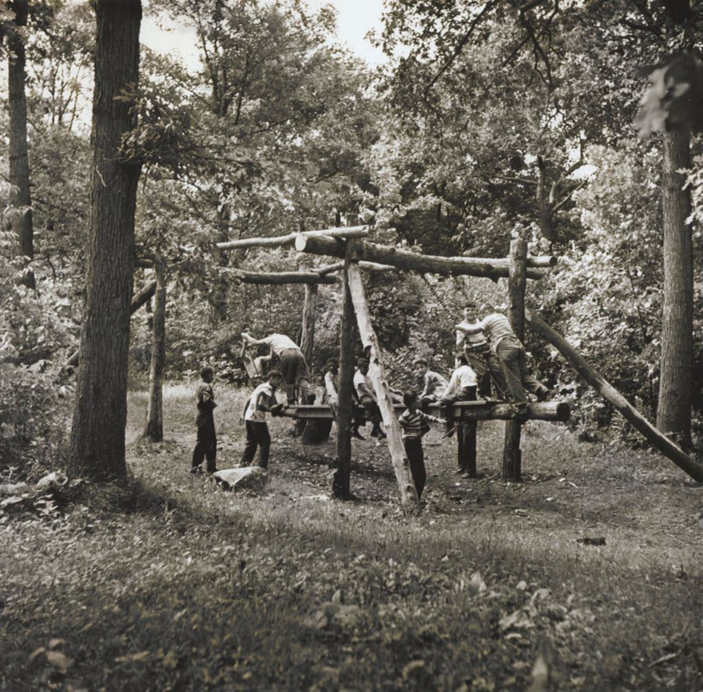 Miniature of Boys on wooden playground equipment