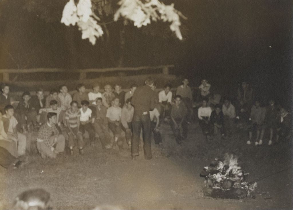 Miniature of Talking to boys and girls around campfire