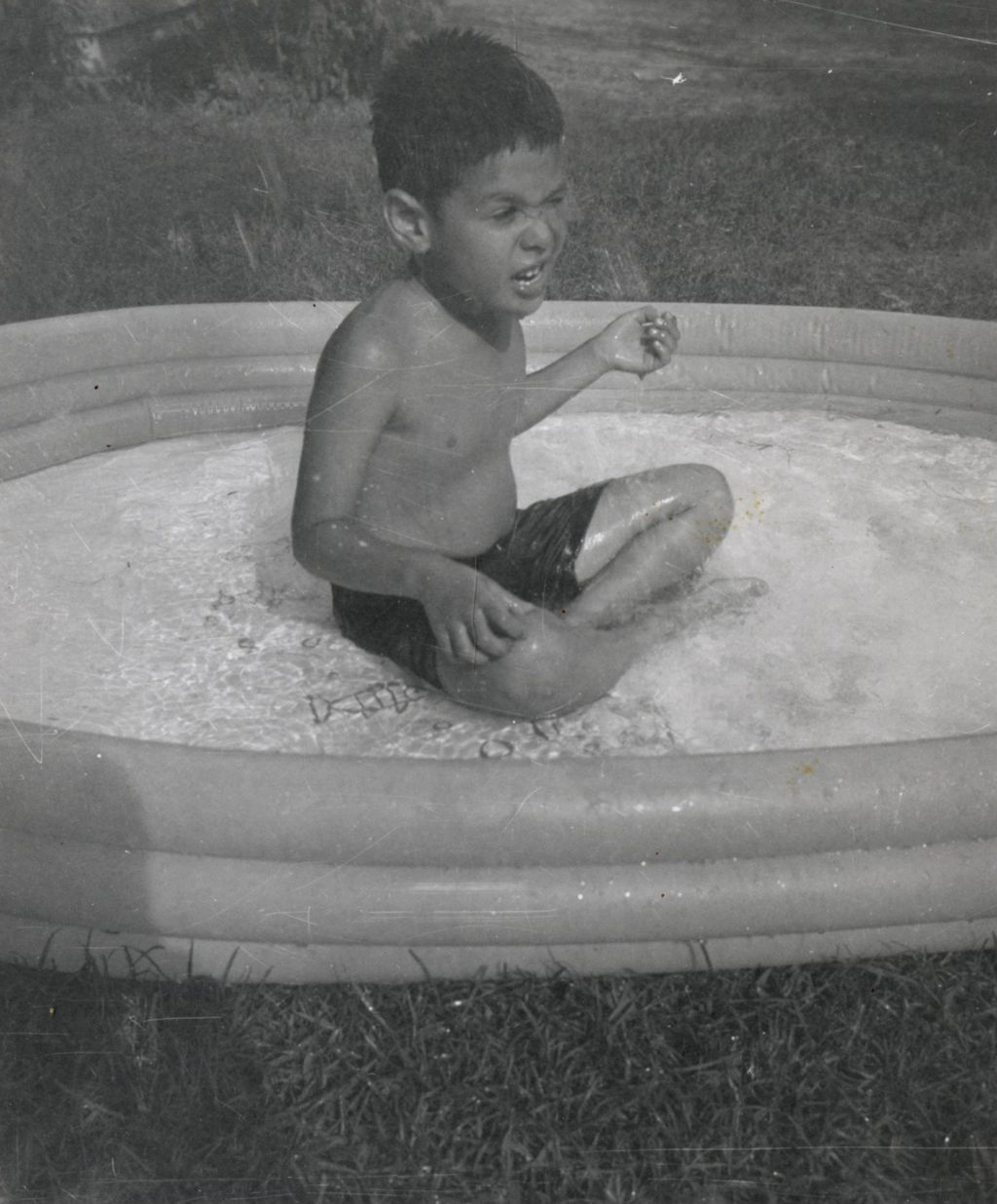 Boy in wading pool