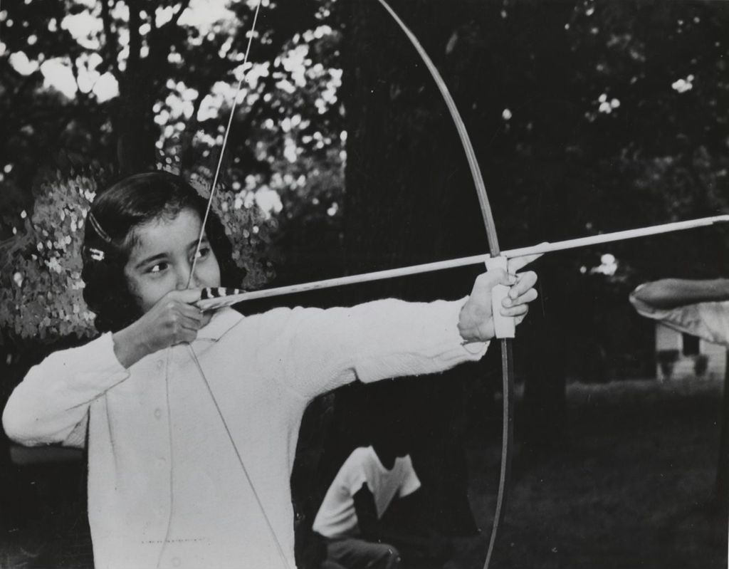 Girl shooting arrow