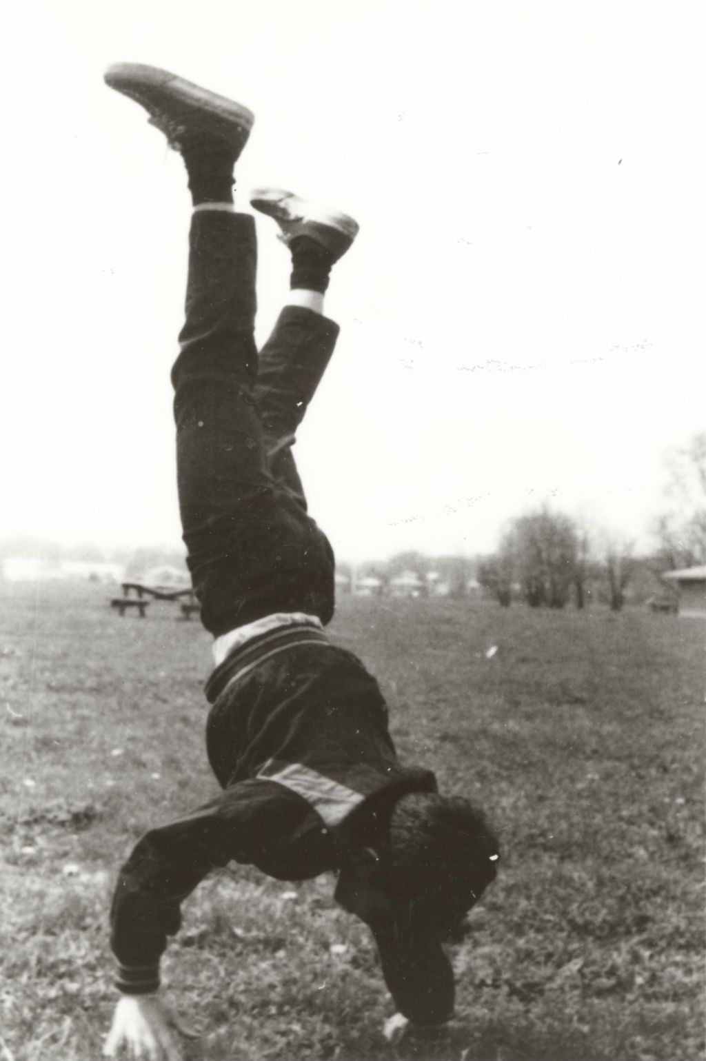 Boy doing cartwheel at Bowen Country Club