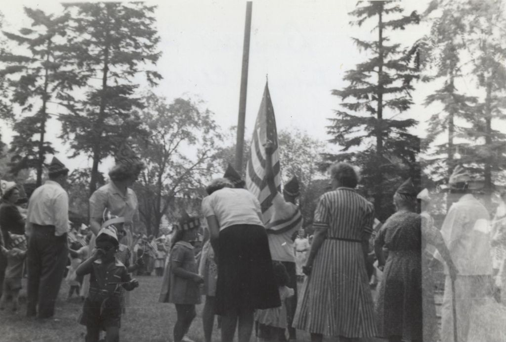 Adults at flag raising