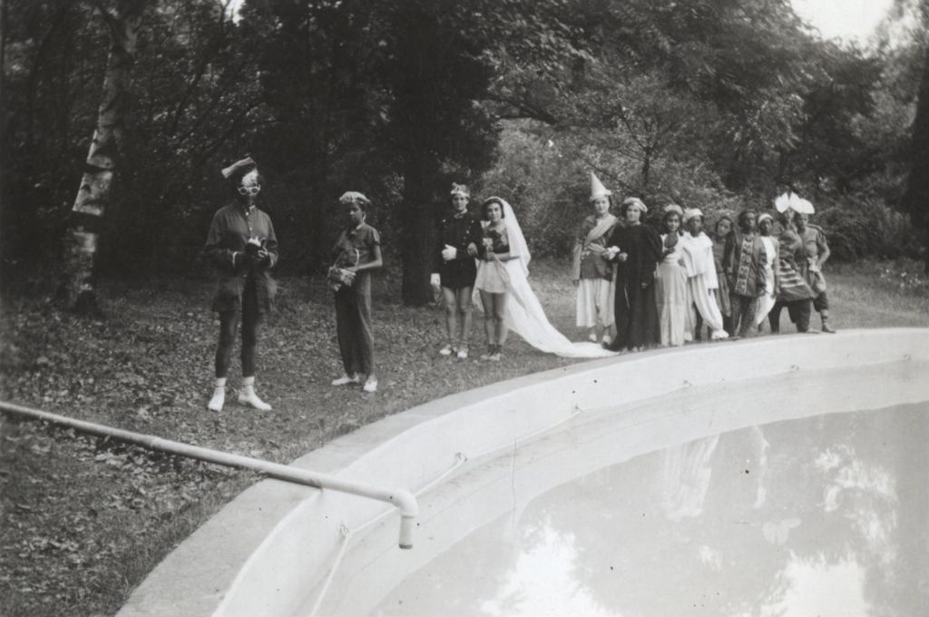 Mock wedding procession near pool