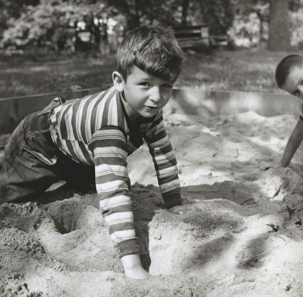 Miniature of Boy playing in sand