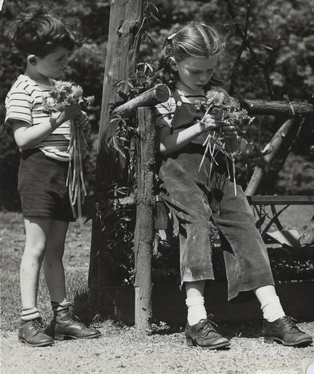 Boy and Betty Ann Gaber holding nosegays