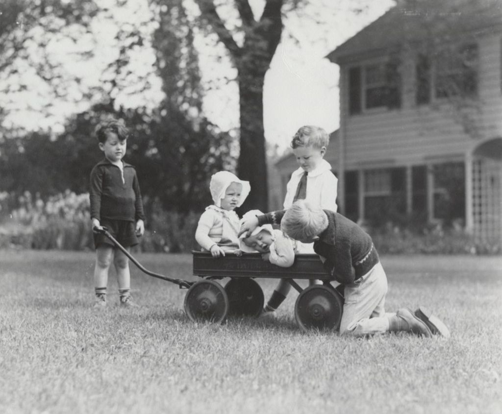 Miniature of Children play with wagon outside Lilac Cottage