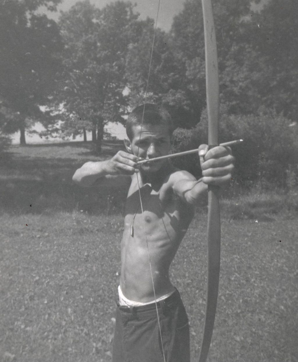Miniature of Jimmy Tarsitano shooting bow and arrow