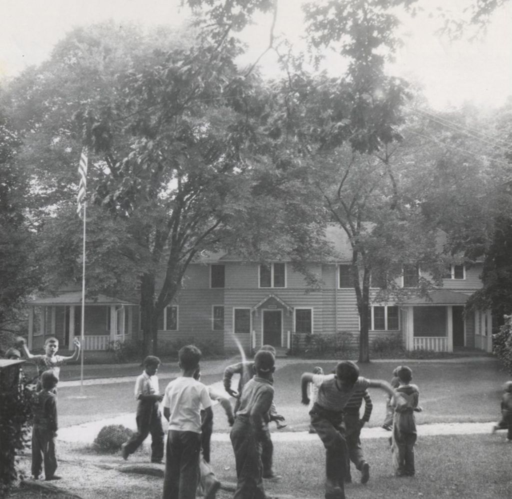 Boys playing outside Lansingh Cottage