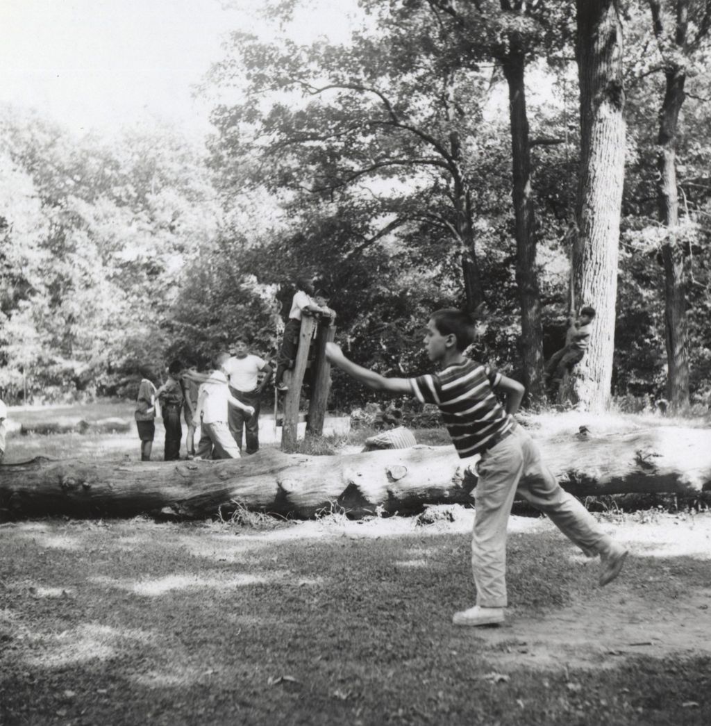 Boy playing horseshoes at Camp French