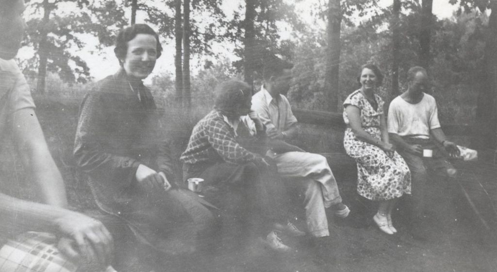 Miniature of Men and women sitting on log