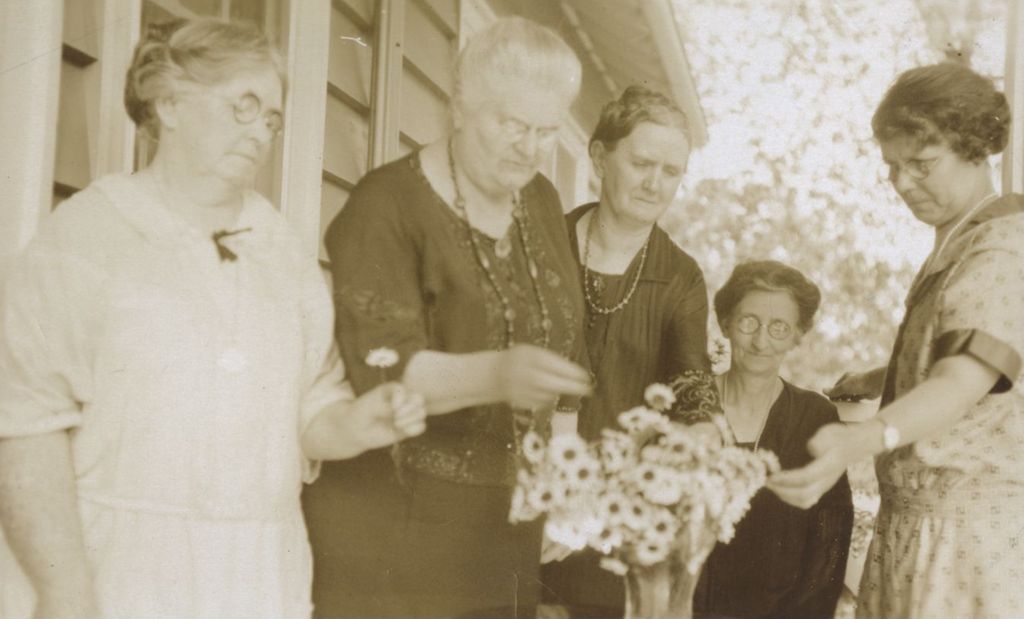 Miniature of Women looking at vase of flowers