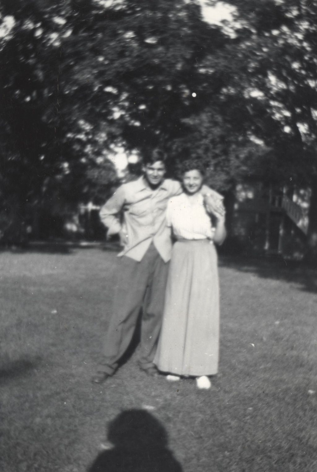 Joe Beloshi standing with woman in long skirt