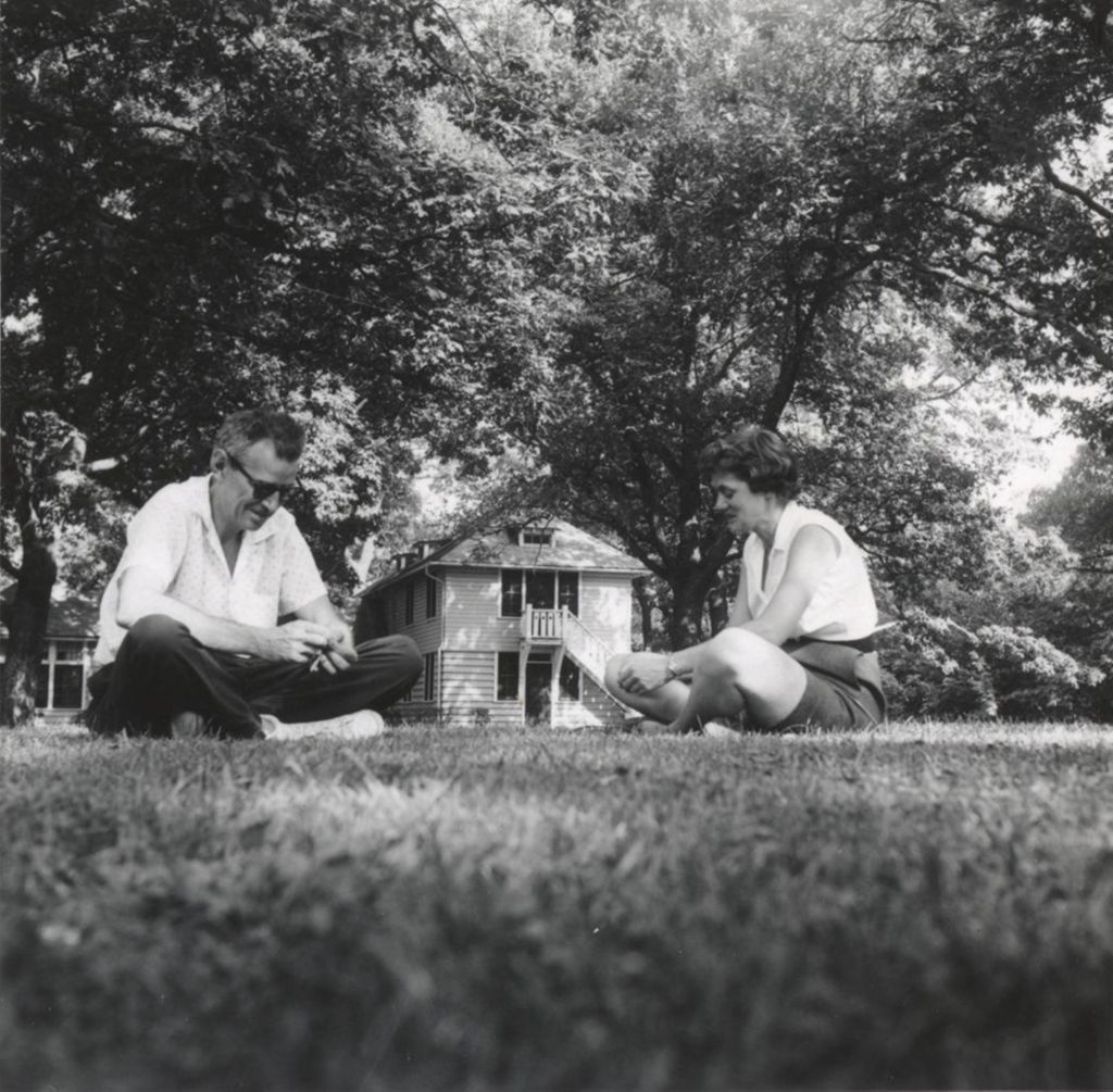 Miniature of Adults sitting on lawn in front of Smith Cottage