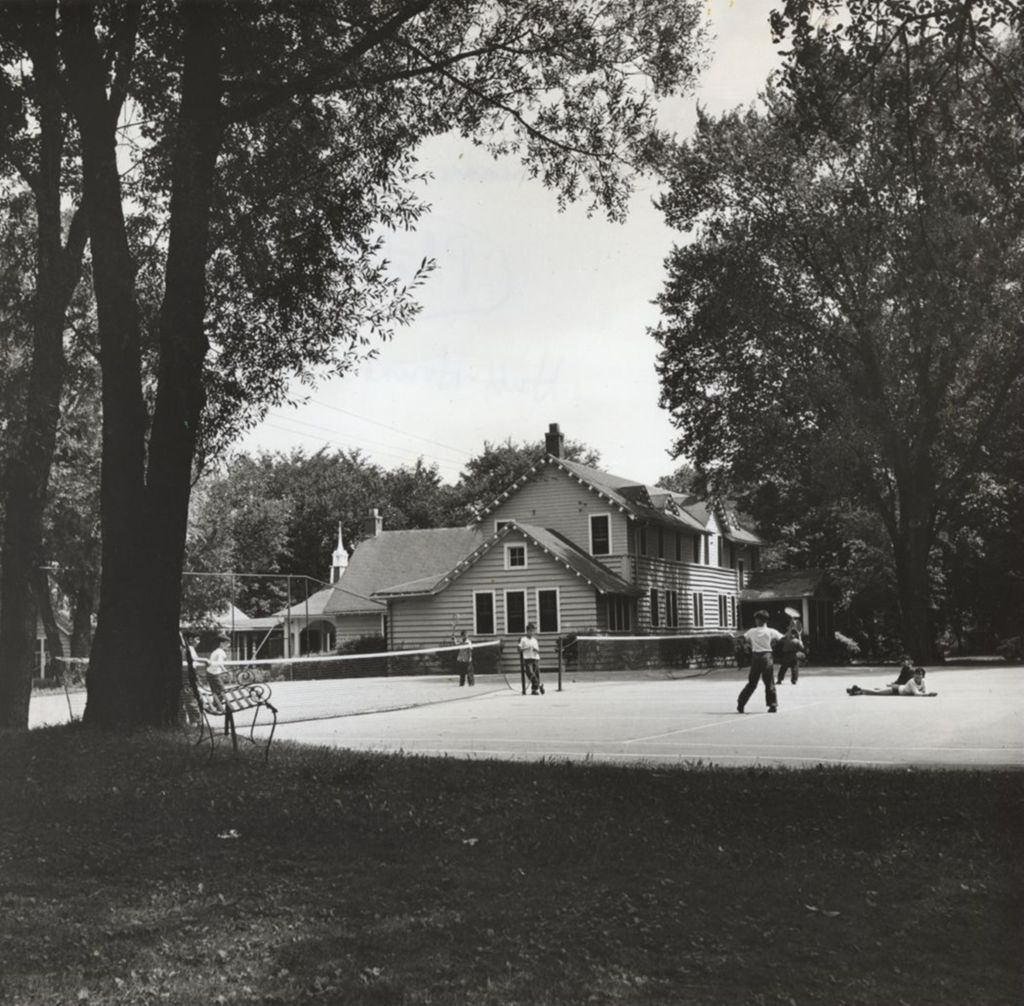 Boys playing tennis outside Commons (kitchen) area; Bowen Country Club 50th Anniversary