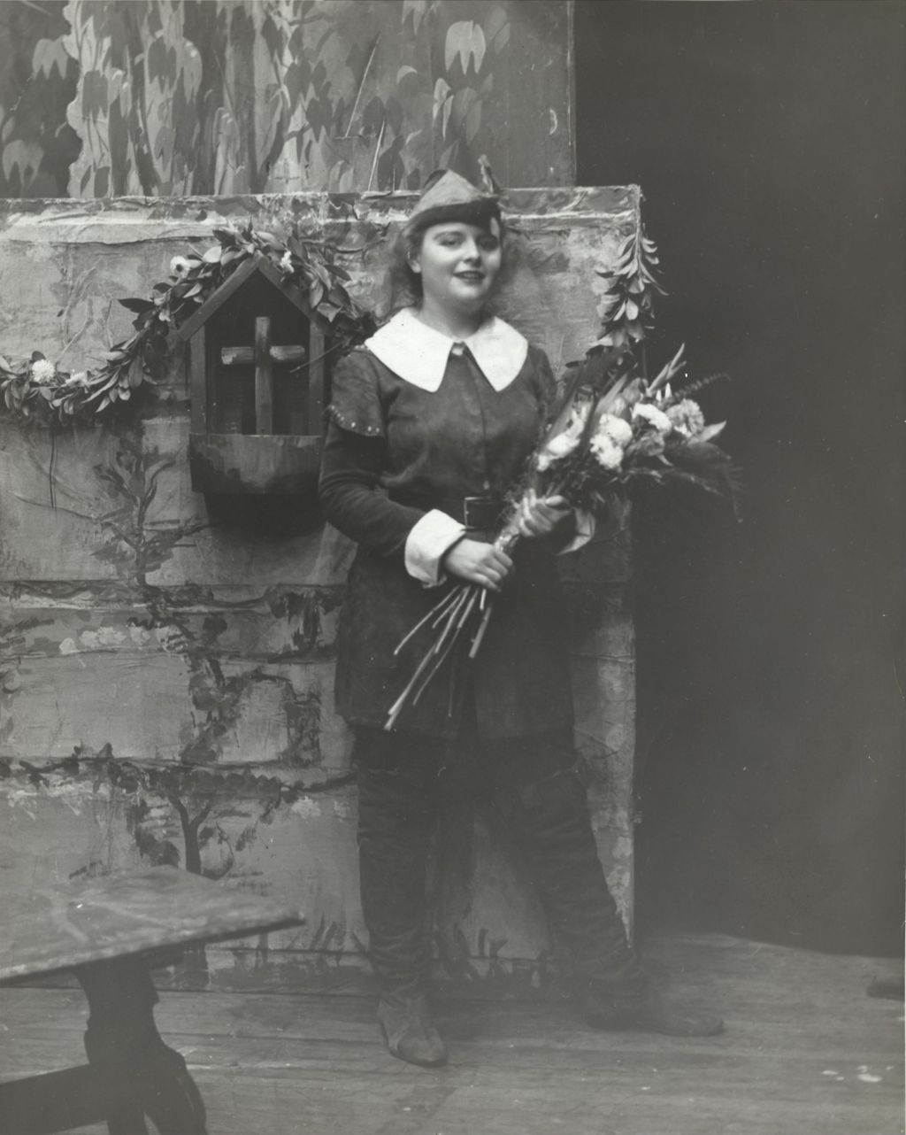 Miniature of Hull-House Theatre performer holding a flower bouquet