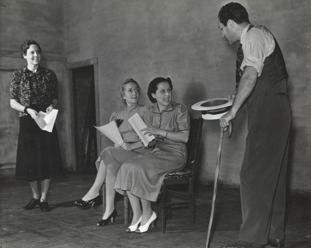 Miniature of Helen Tieken directing members of the Hull-House Theatre Guild in a rehearsal for the play "One Sunday Afternoon"