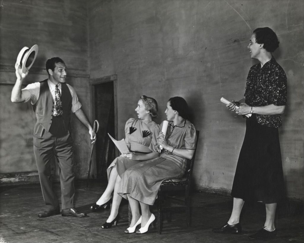 Miniature of Helen Tieken directing members of the Hull-House Theatre Guild in a rehearsal for the play "One Sunday Afternoon"