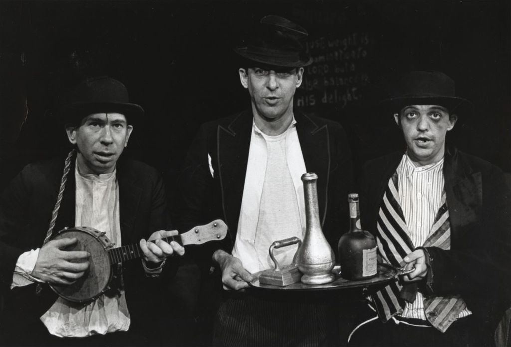 Miniature of David Eisen, Ed Shaeffer, and Mike Miller sing on stage in a production of "The Threepenny Opera" at Hull-House Theater