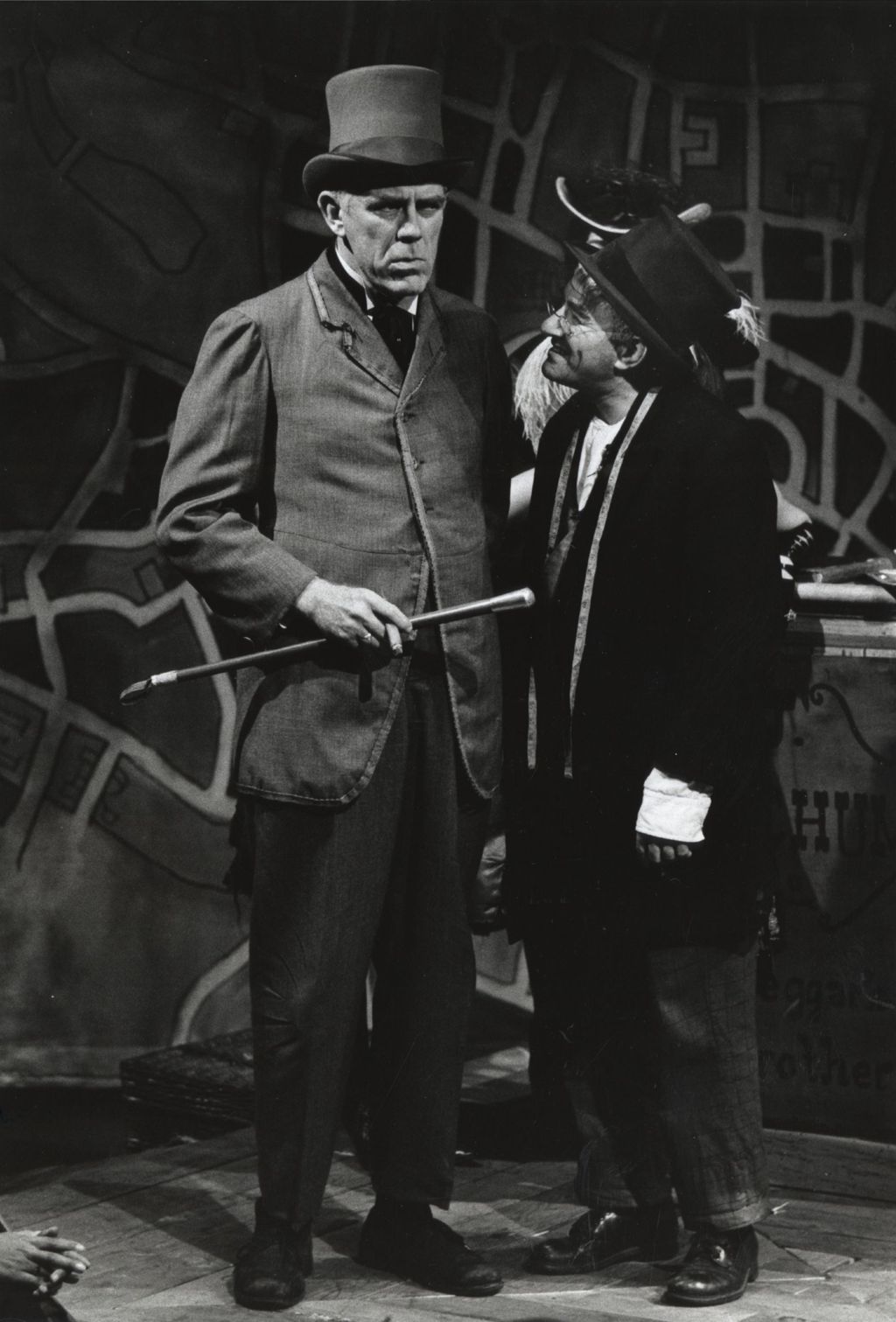 Tom Kelly and Franklyn Alexander on stage in a production of "The Threepenny Opera" at Hull-House Theater