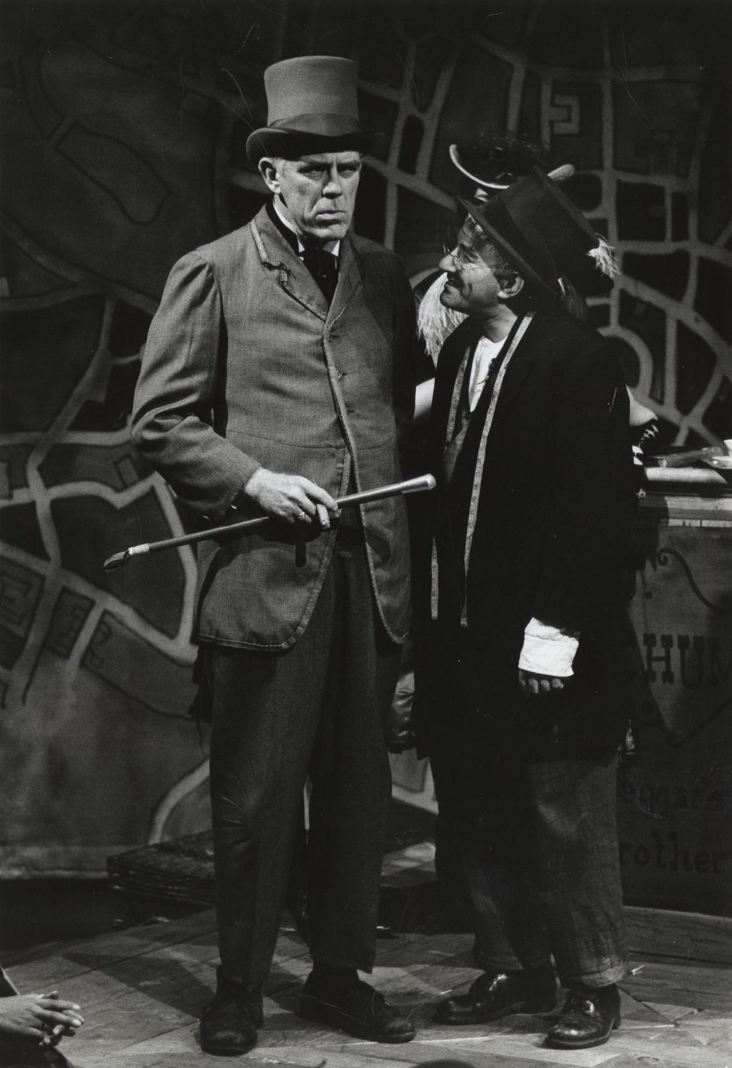 Tom Kelly and Franklyn Alexander on stage in a production of "The Threepenny Opera" at Hull-House Theater
