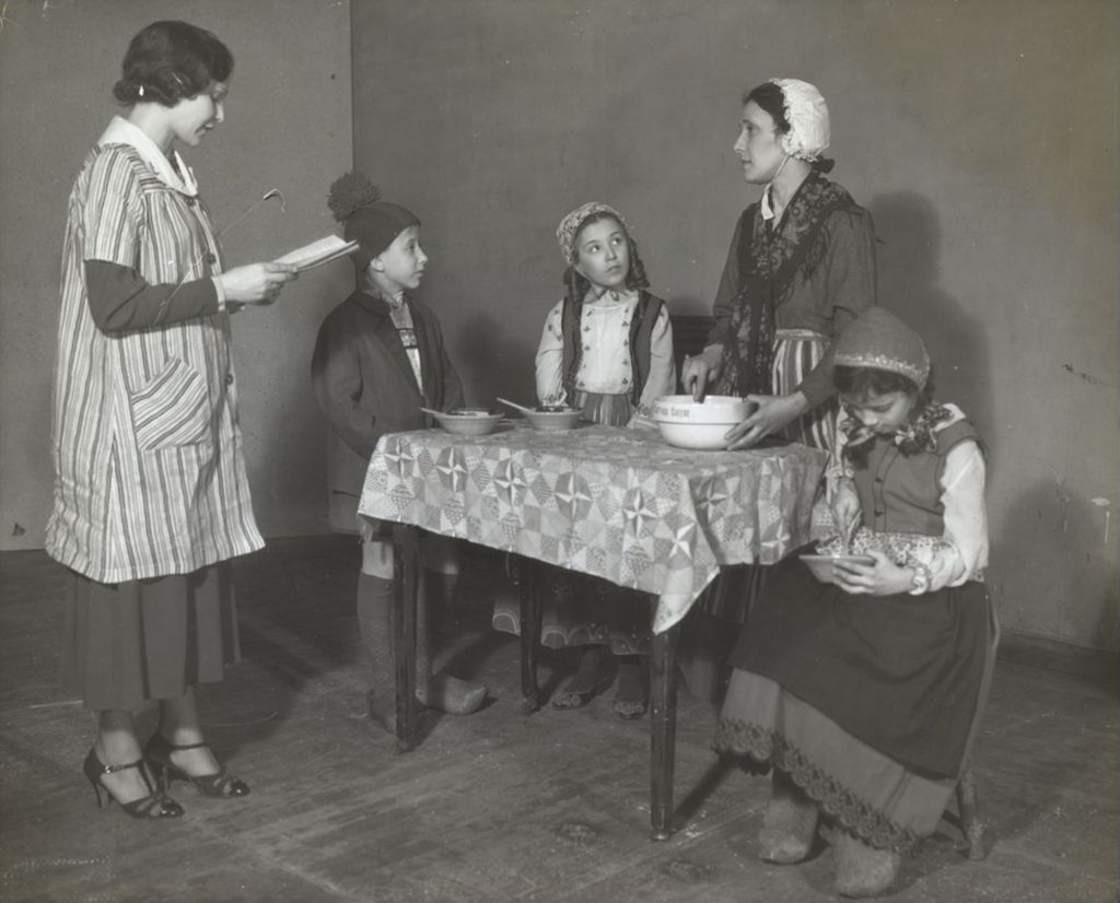 Miniature of Hull-House staffer Nicolette Malone working with actors for a dramatic performance