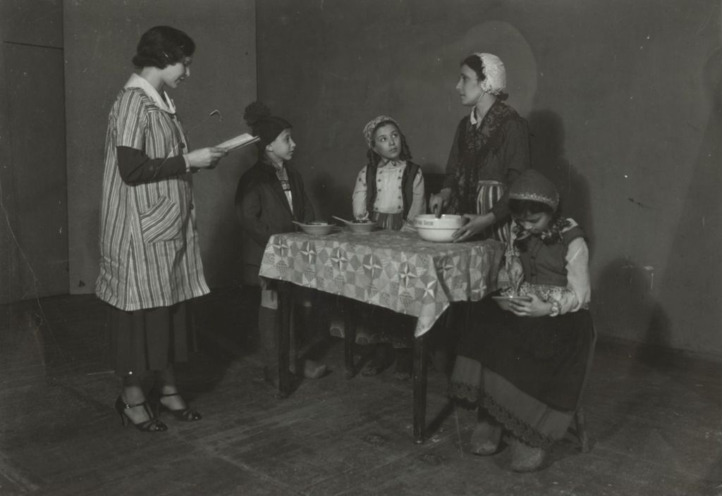 Miniature of Hull-House staffer Nicolette Malone working with actors for a dramatic performance