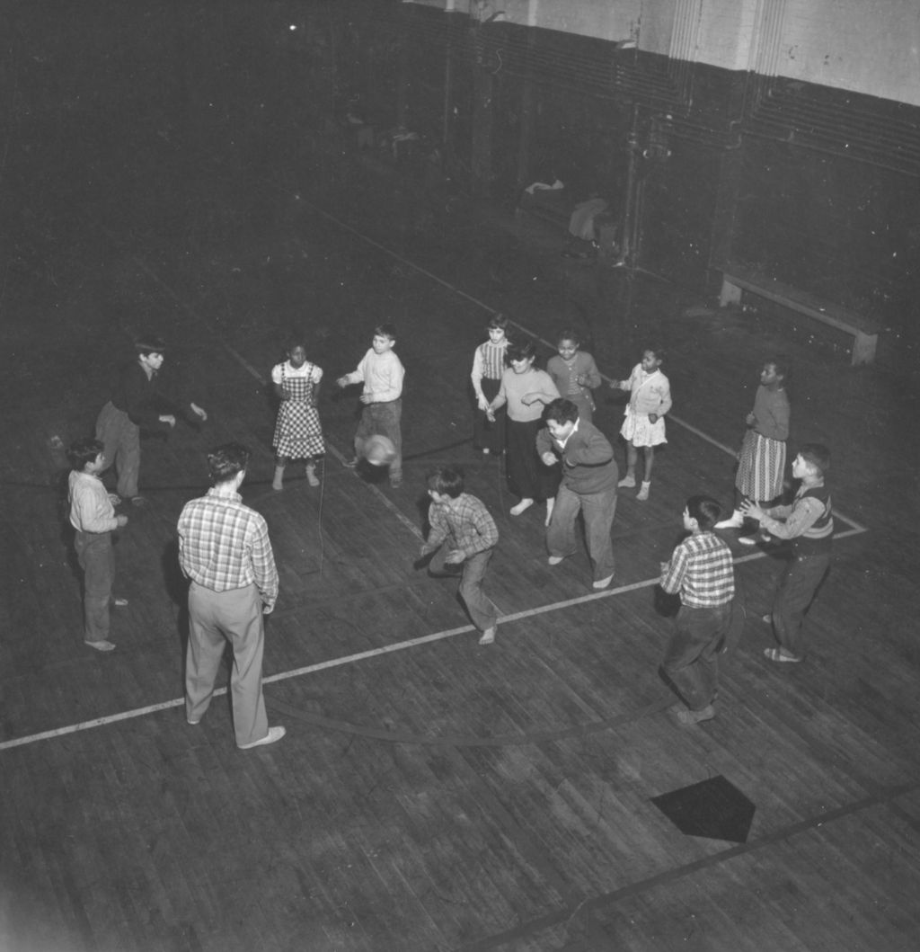 Teens playing circle dodgeball at Hull-House