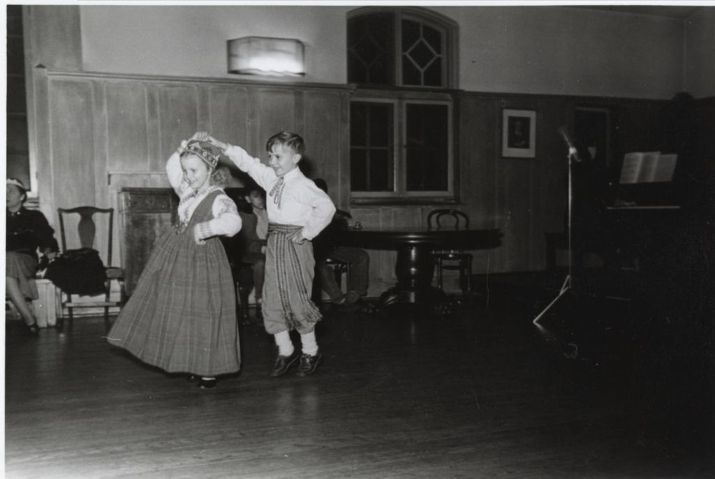Two children performing a Latvian folk dance at the Hull-House 1951 Spring Carnival