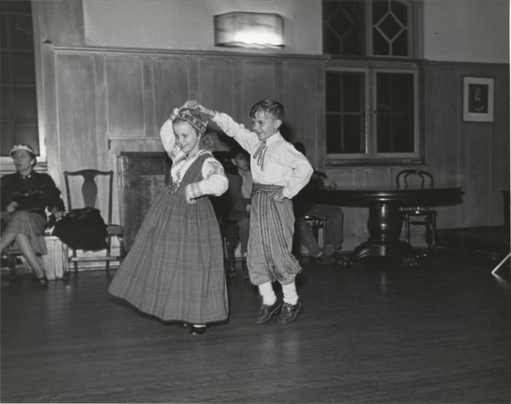 Two children performing a Latvian folk dance at the Hull-House 1951 Spring Carnival