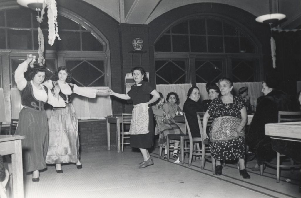 Women in traditional Greek clothing dancing during Hull-House 1951 Spring Carnival