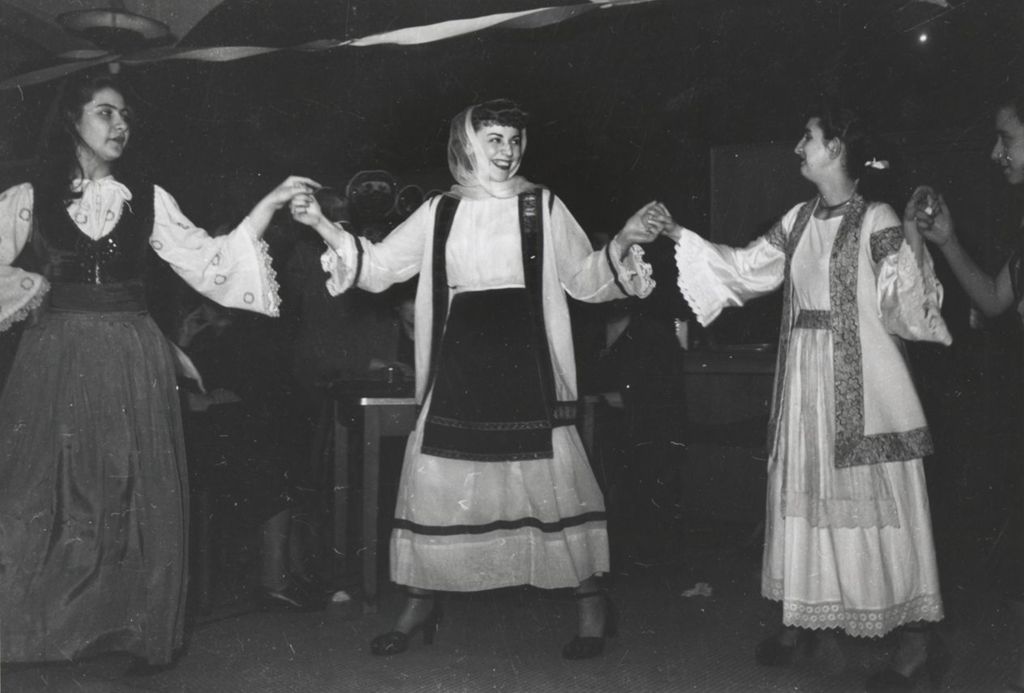 Women in traditional Greek clothing dancing during Hull-House 1951 Spring Carnival