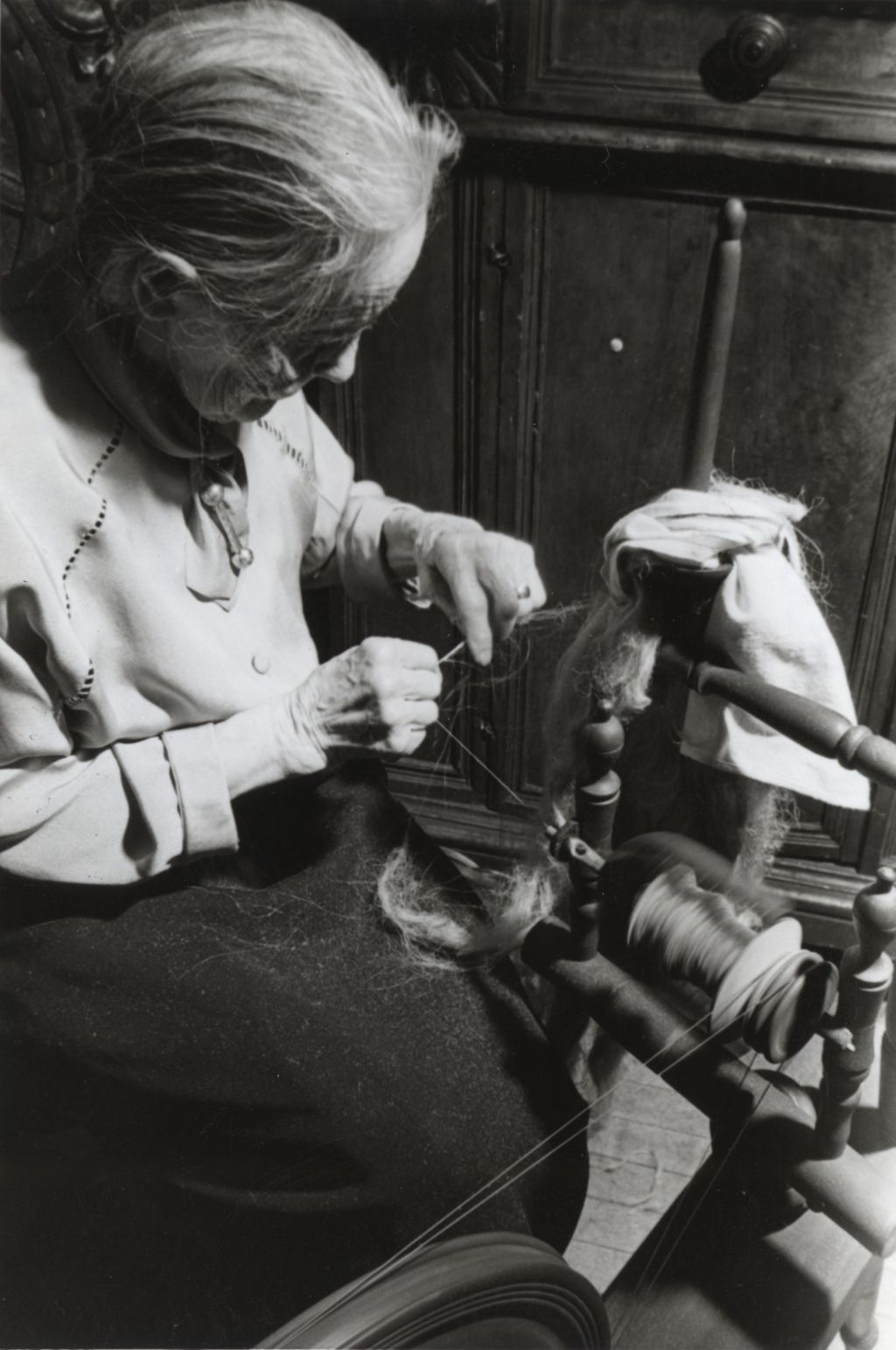 Miniature of Woman at a spinning wheel during Hull-House 1951 Spring Carnival