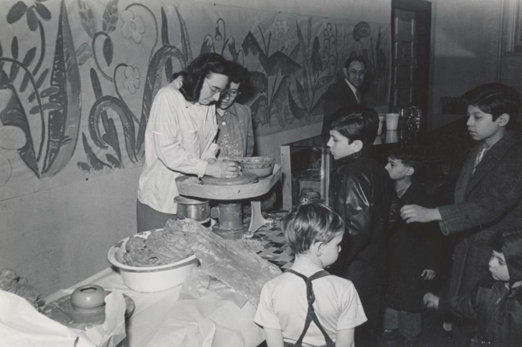 Children watch a pottery demonstration at the Hull-House 1951 Spring Carnival