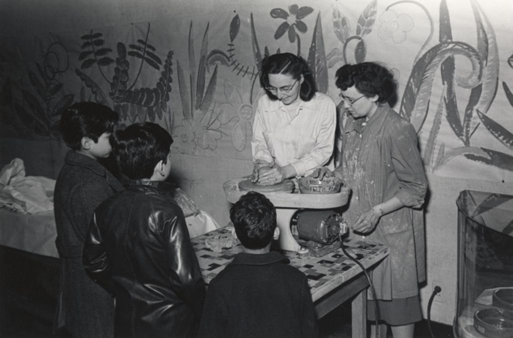 Boys watch a pottery demonstration at the Hull-House 1951 Spring Carnival