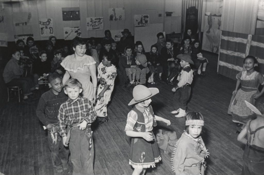 A group of costumed children and an instructor perform a "Wild West show" during the 1951 Hull-House Spring Carnival