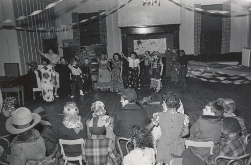 A group of costumed children and an instructor perform a "Wild West show" during the 1951 Hull-House Spring Carnival
