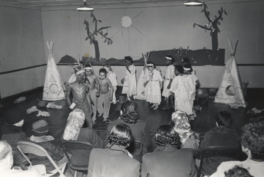 Children dressed in Native American costumes in a theatrical production at Hull-House