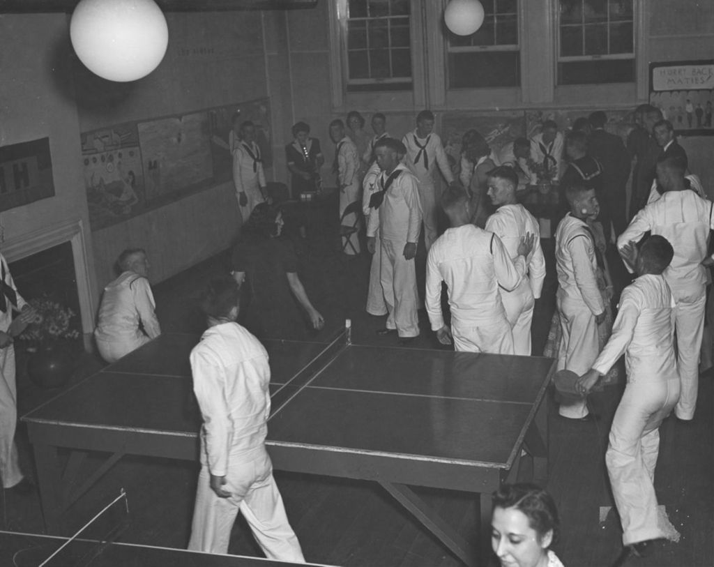 United States Navy sailors and civilians in a game room at Hull-House during an "Entertaining the Navy" event