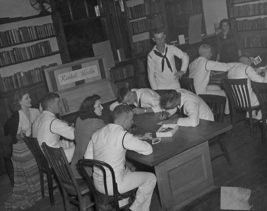 Miniature of United States Navy sailors in a Hull-House library during an "Entertaining the Navy" event