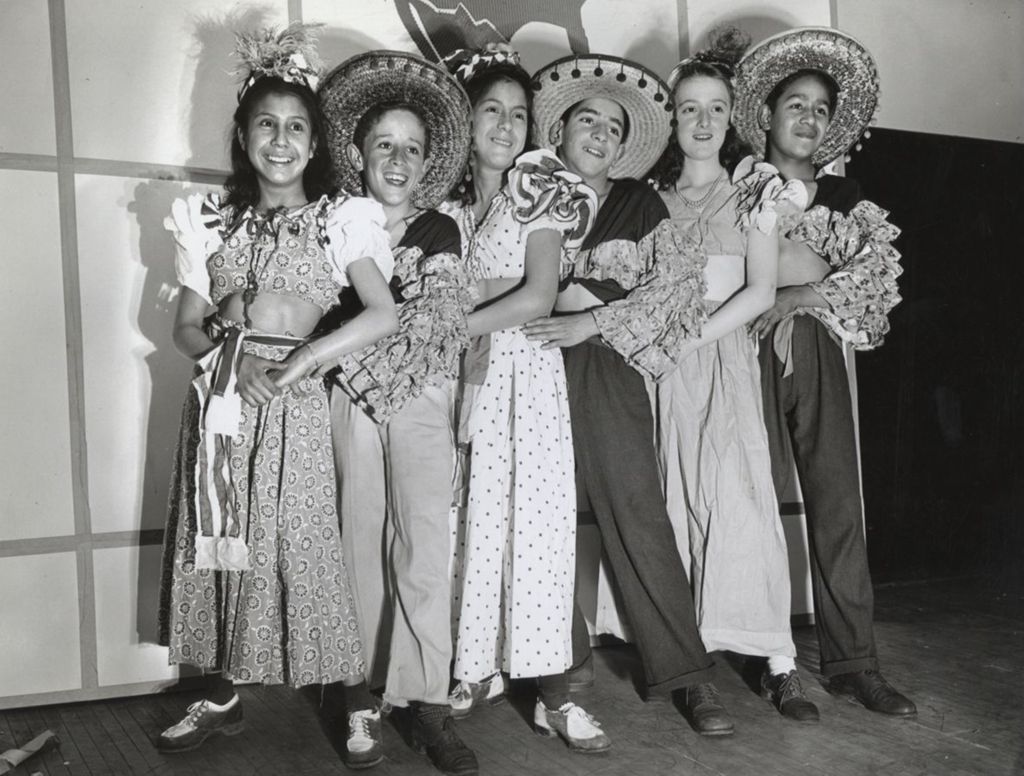 Six young dancers in traditional Mexican clothing at the 1942 Hull-House Associates annual meeting