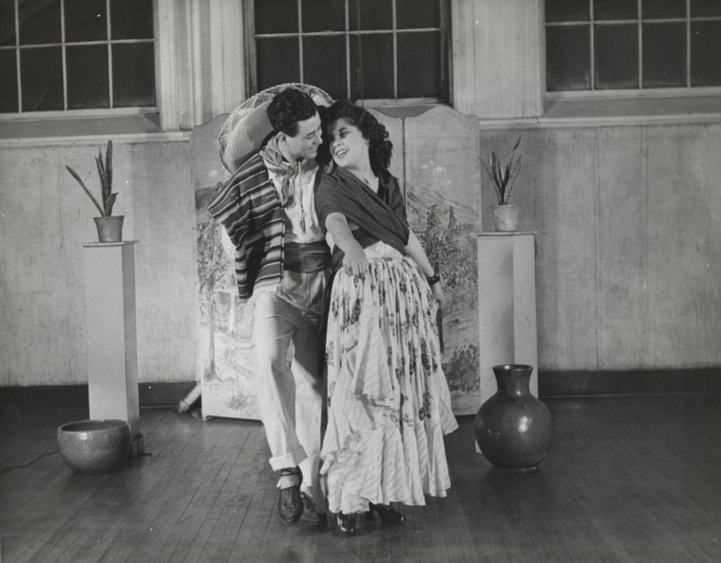 Hull-House instructor Marie Garcia and unidentified man dancing as part of Mexican Fiesta