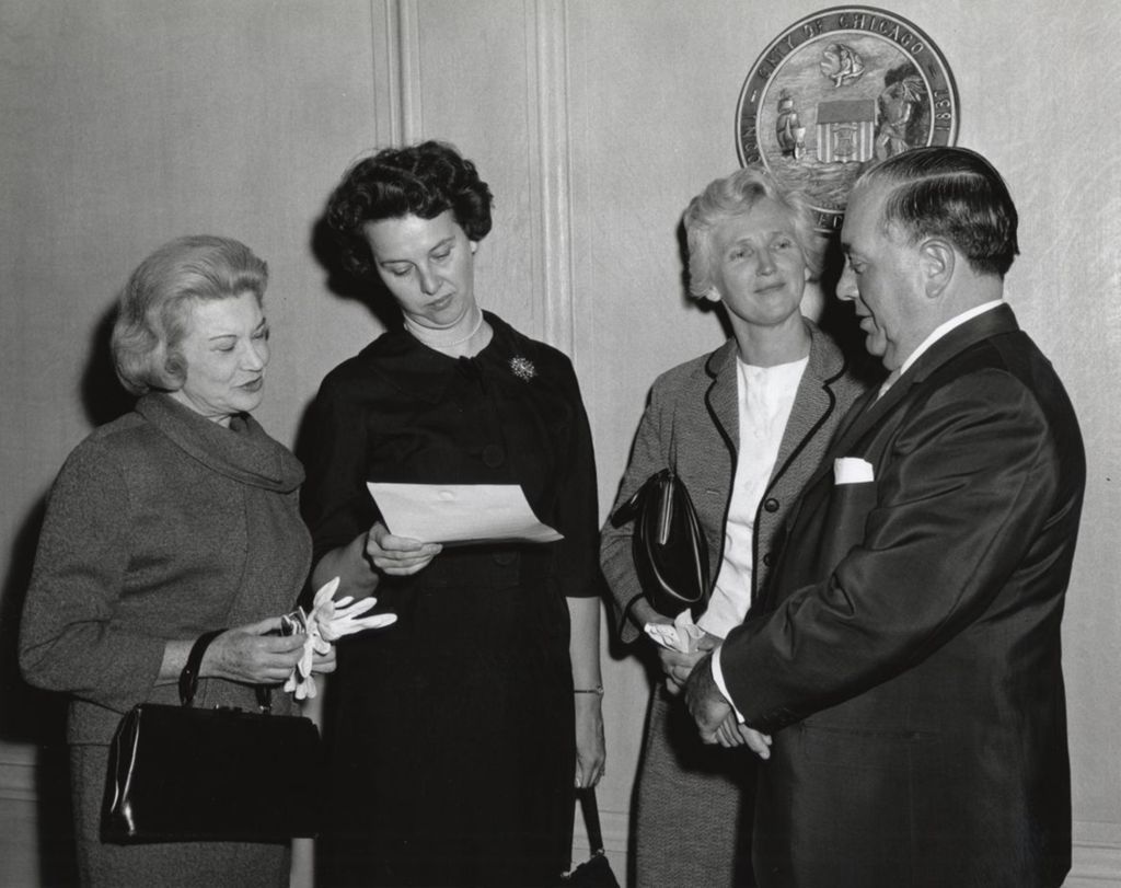 Three members of the Hull-House board of directors with Chicago mayor Richard J. Daley