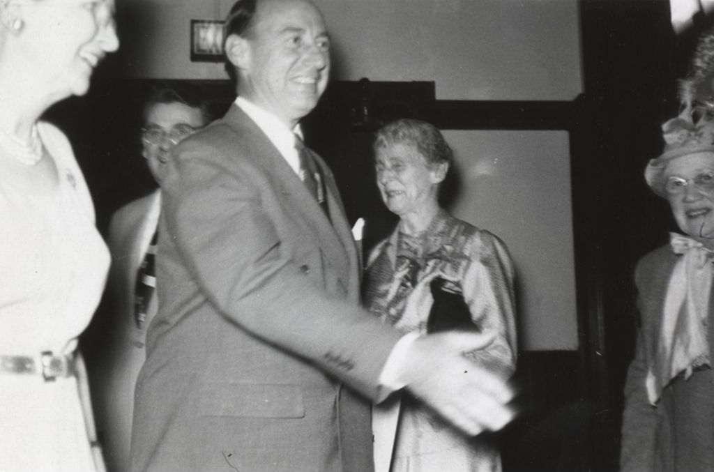 Miniature of Illinois governor Adlai Stevenson II on a visit to Hull-House, with Hull-House resident Jessie Binford also pictured