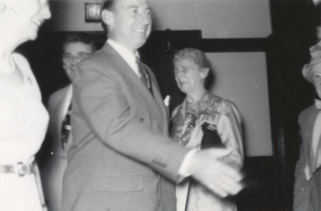 Illinois governor Adlai Stevenson II on a visit to Hull-House, with Hull-House resident Jessie Binford also pictured