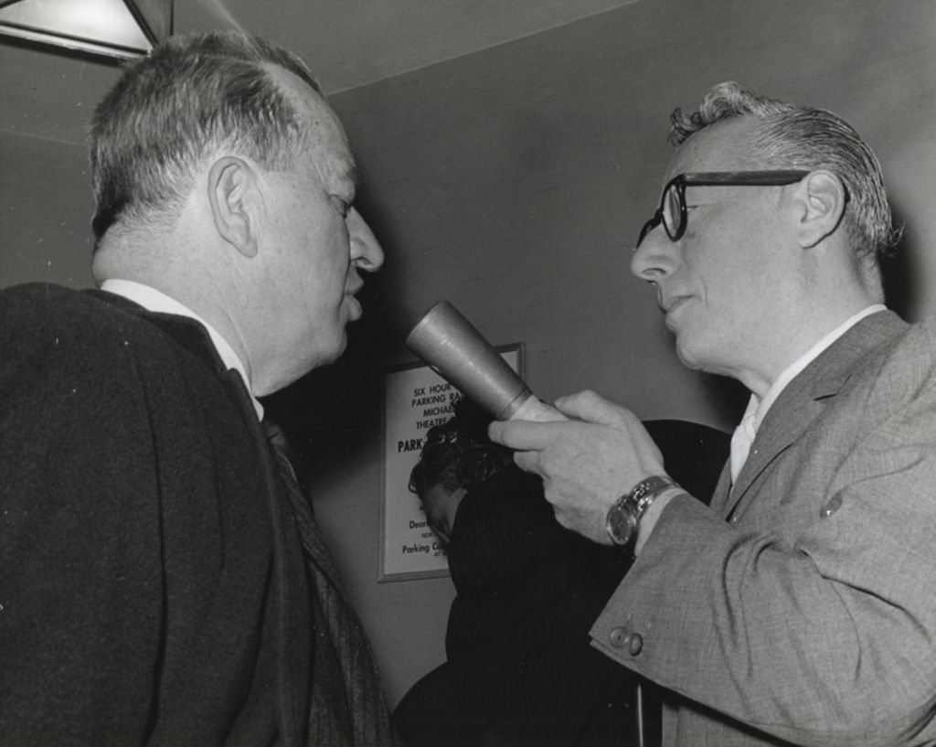 Miniature of Radio host Jack Eigen interviewing architect James Downs, Jr. at the Chicago premiere of the film West Side Story at the Michael Todd Theatre. The premiere was a benefit for Hull-House
