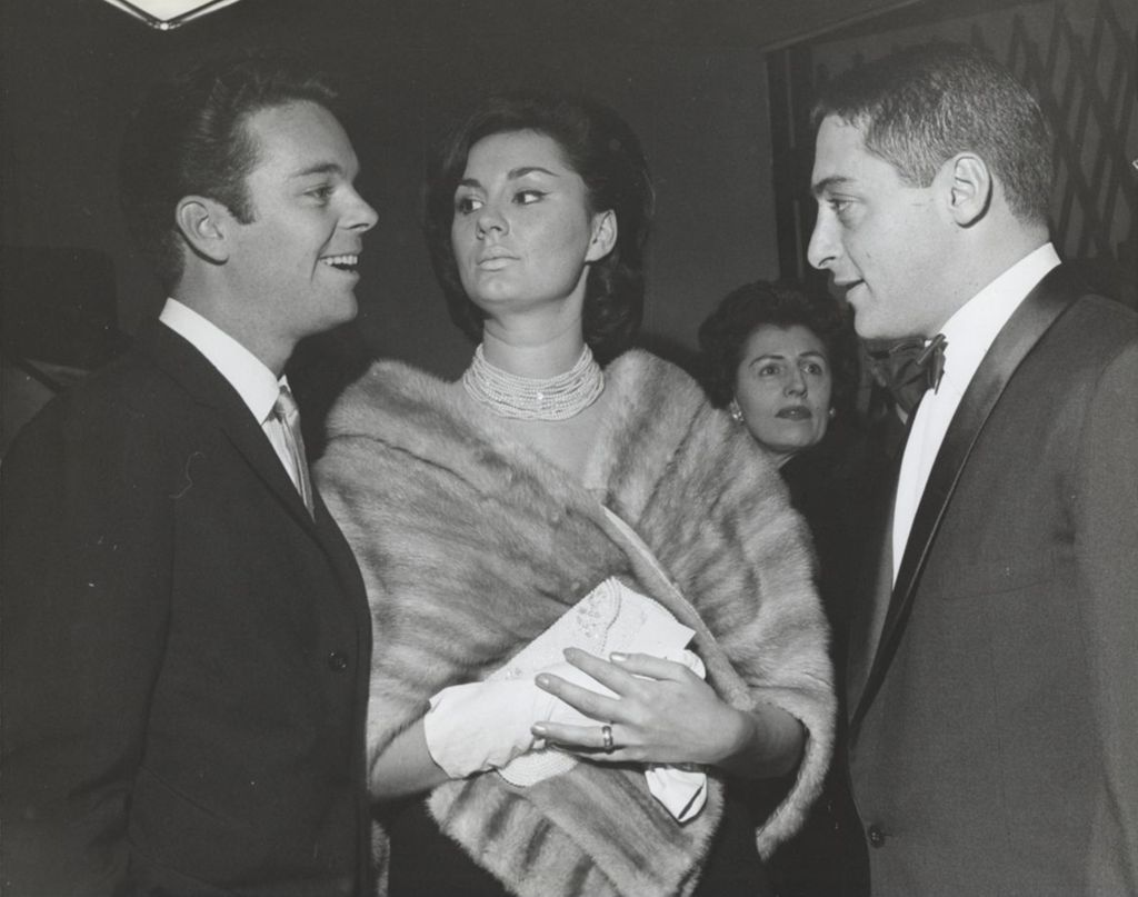 Miniature of Actor Russ Tamblyn, his wife Elizabeth Kempton, and film producer Michael Todd, Jr. at the Chicago premiere of the film West Side Story at the Michael Todd Theatre. The premiere was a benefit for Hull-House