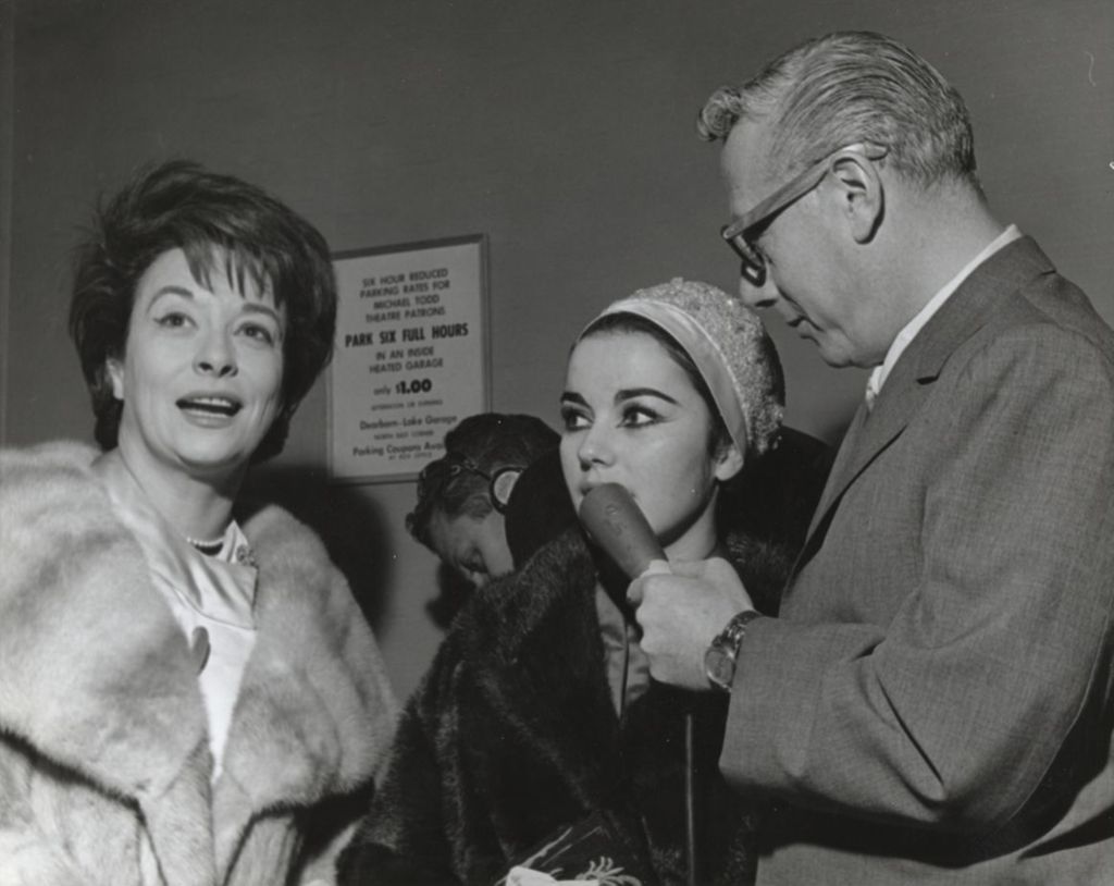 Radio host Jack Eigen interviewing Chicago Tribune columnist Maggie Daly and her daughter, actress Brigit Bazlen, at the Chicago premiere of the film West Side Story at the Michael Todd Theatre. The premiere was a benefit for Hull-House