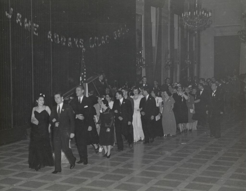 Pairs of attendees in a line at the 1941 Lilac Ball at the Stevens Hotel