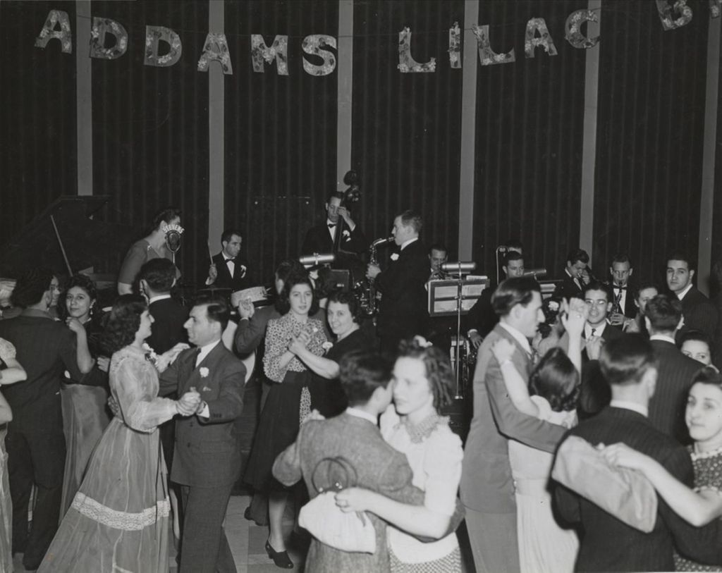 Miniature of Couples dancing to a live band at the 1941 Lilac Ball at the Stevens Hotel